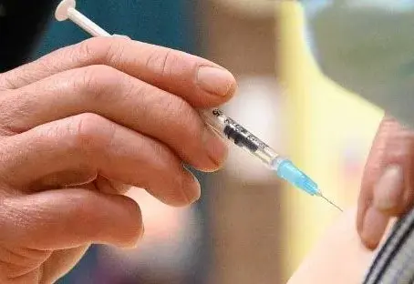 Person about to be given a vaccine. 