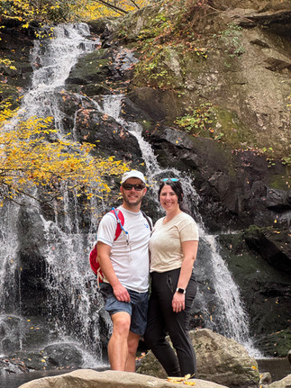 A couple standing in front of Spruce Flats Falls