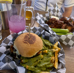An elk burger with chimichurri fries and lemonade