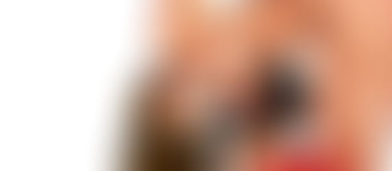 A naked woman leans into a man's face