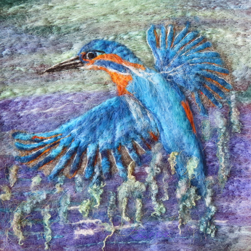 Fibre art portrait of a wet Kingfisher in flight
