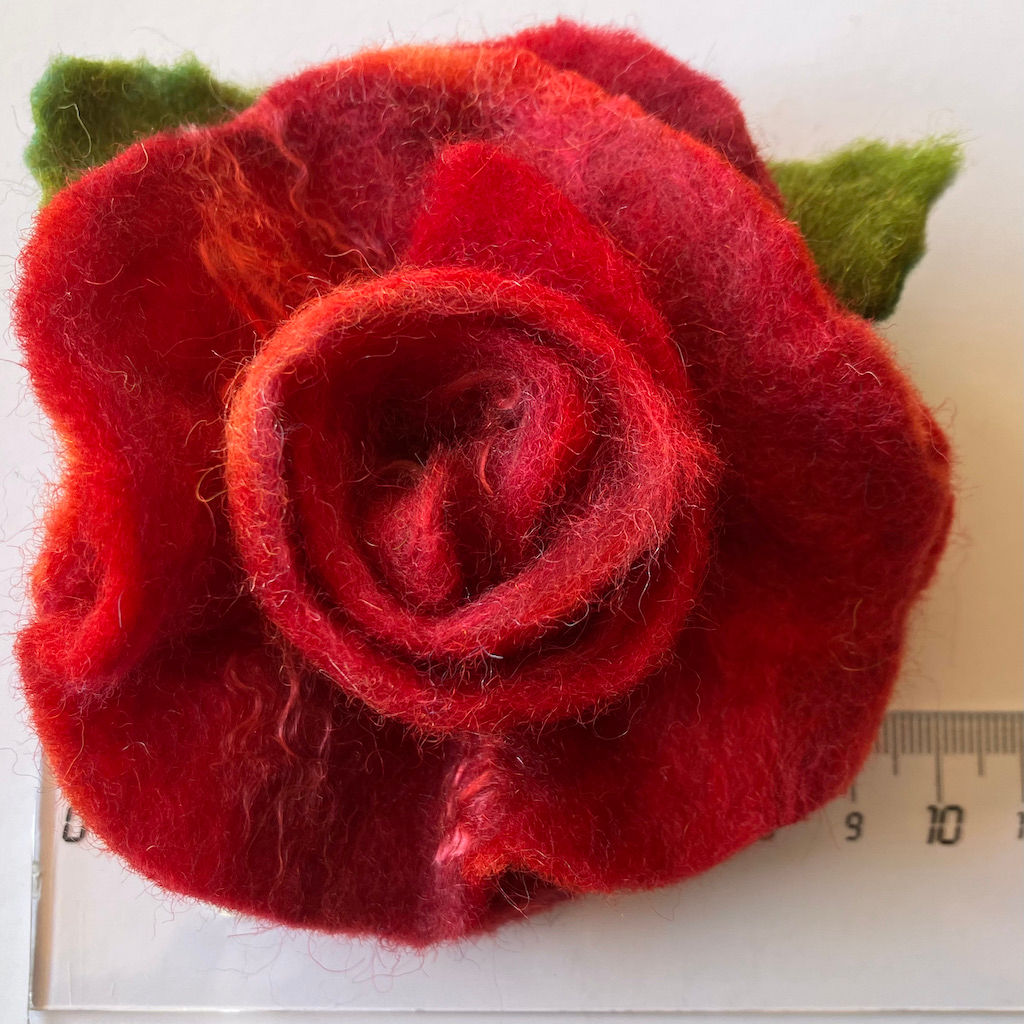 Red rose felt corsage with a magnetic fastening