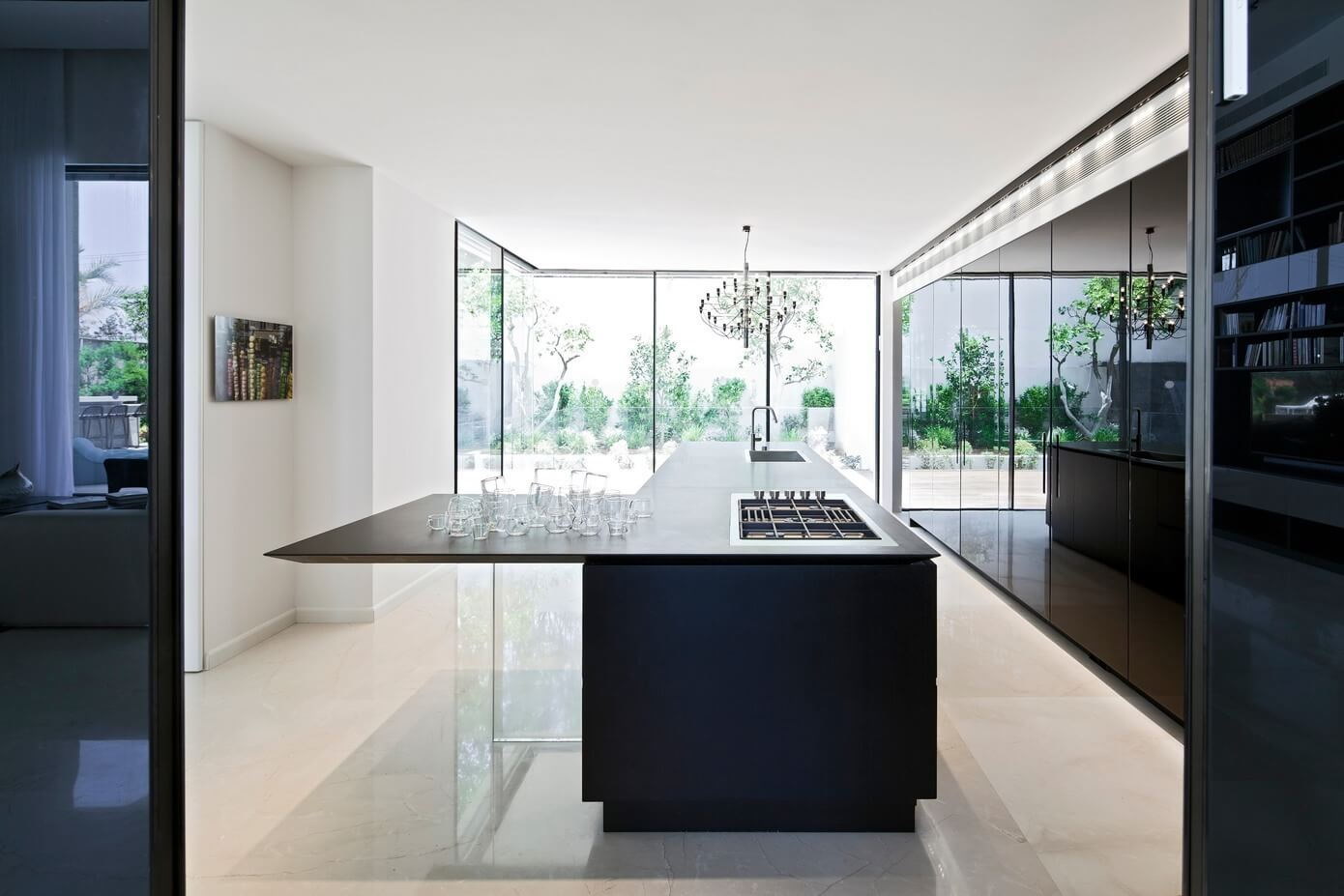 Fort Lauderdale waterfront modern glossy kitchen in black and stone by iKitchen Cabinetry