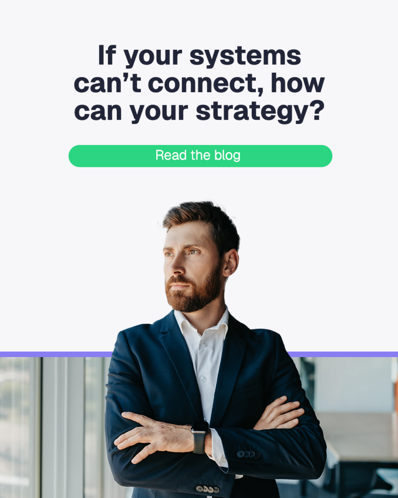 Man in a suit looks thoughtful by a window. Text reads, "If your systems can't connect, how can your strategy?" with "Read the blog" button.