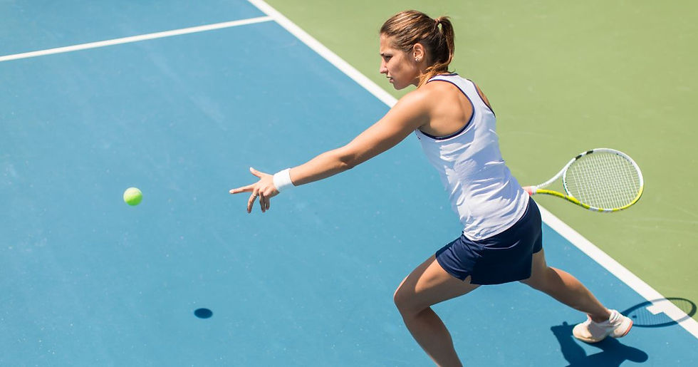 tennis player hits ball with best tennis racket