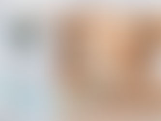 White HEPA air purifier in a sunny living room, tan couch in the background. Airflow indicated by blue swirls and green leaves. Bright mood.