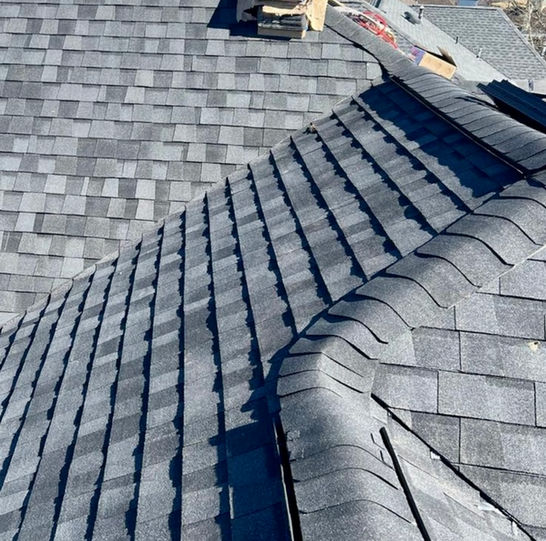 A roof with grey colored shingles