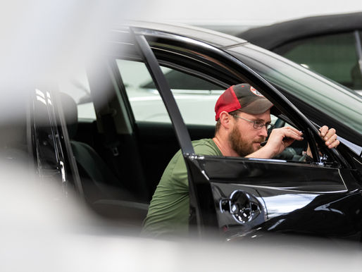 A mechanic in the shop working on a car repair.