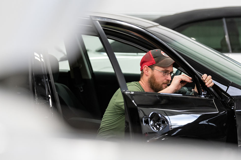A mechanic working on a car repair.