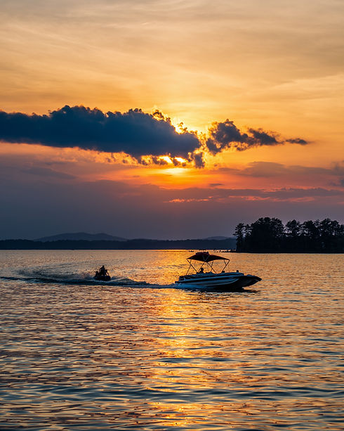 Boat cruising at sunset on Lake Lanier