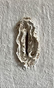 Vulva #12 - Burned plaster vulva sculptures representing trauma and survival