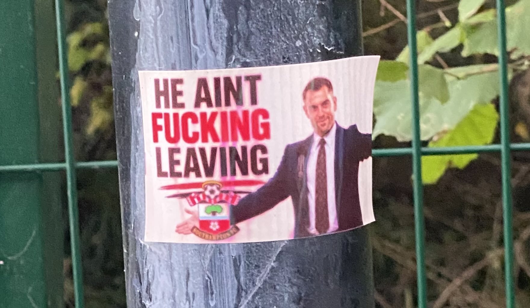 He Ain't Fucking Leaving sticker spotted outdoors