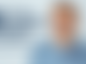 Smiling male patient after full mouth reconstruction at Elonix Dental Clinic in Albania, showcasing successful All-on-4 dental implant treatment.