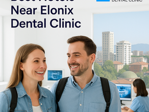 Smiling couple arriving in Tirana for dental tourism, standing inside Elonix Dental Clinic with Tirana skyline and nearby hotels visible through the window, symbolizing comfort and convenience for patients.
