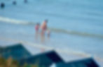 Family entering the sea