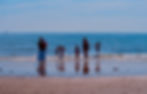 Family enjoying the sea