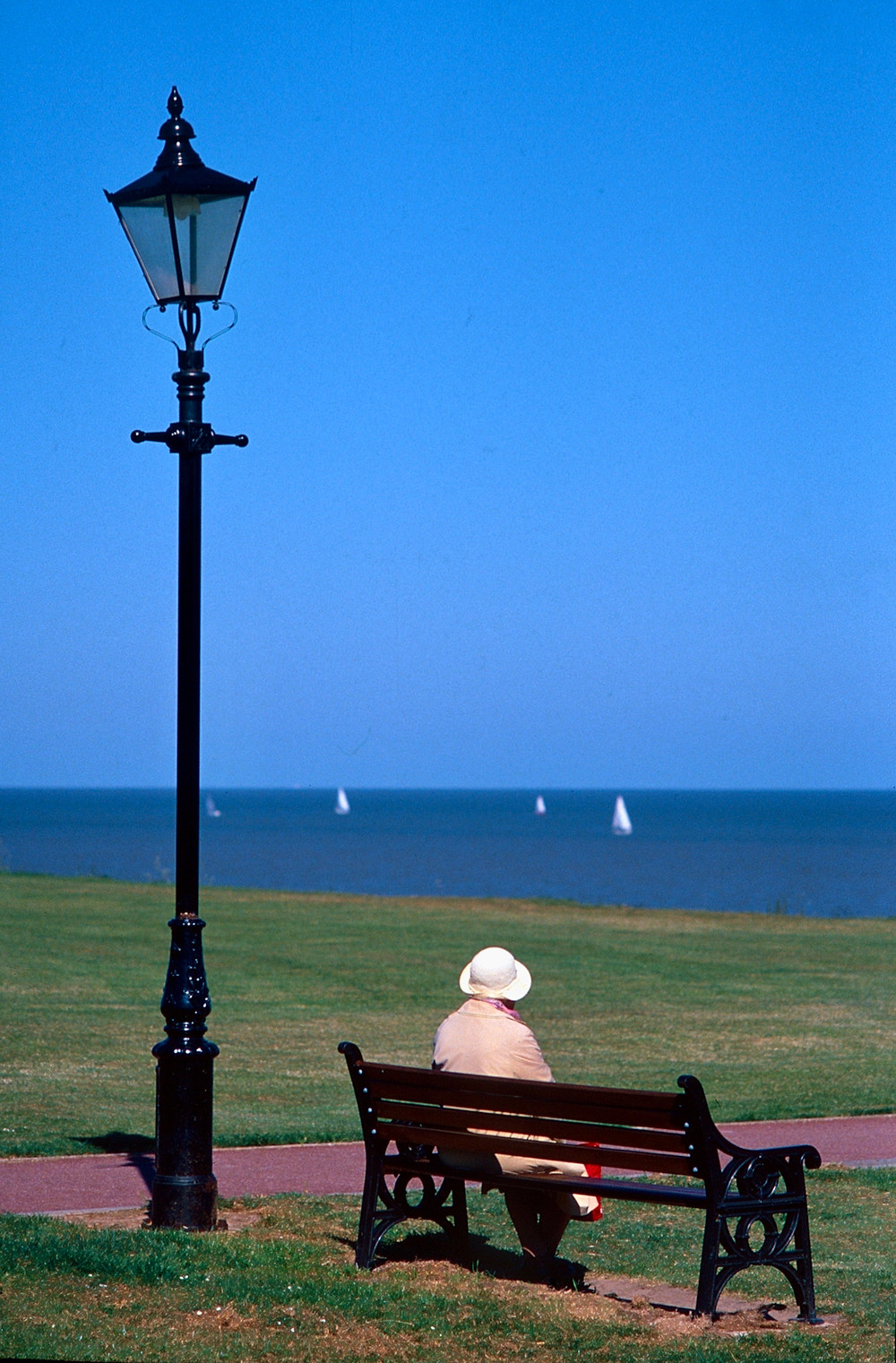 Lady on bench looking out to see