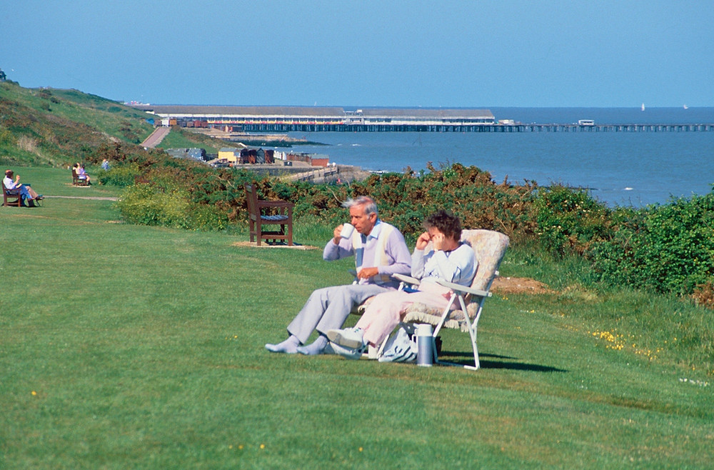 Drinking tea on greensward by great british seaside