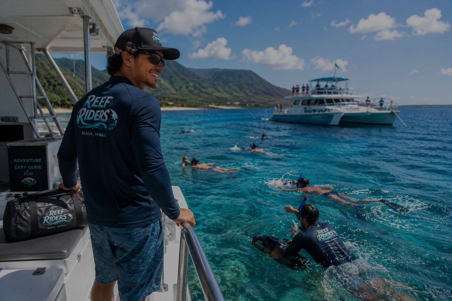 Reef Riders boat owner watching.png