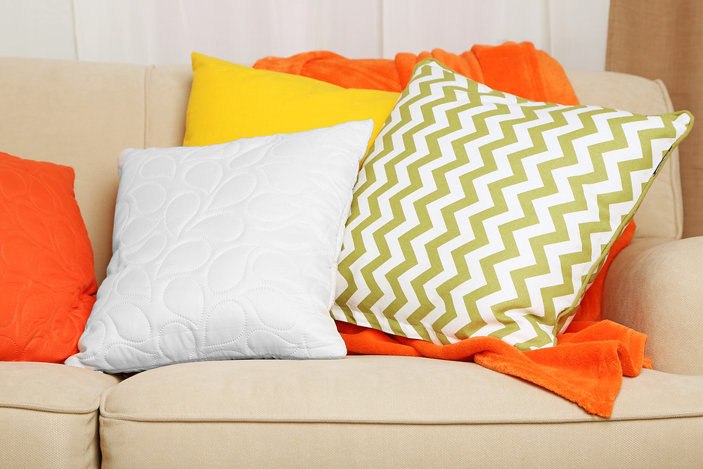 white, yellow and green pillows