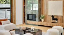 Living Room with white seating and wood tone TV wall