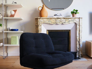 room with fireplace and mirror