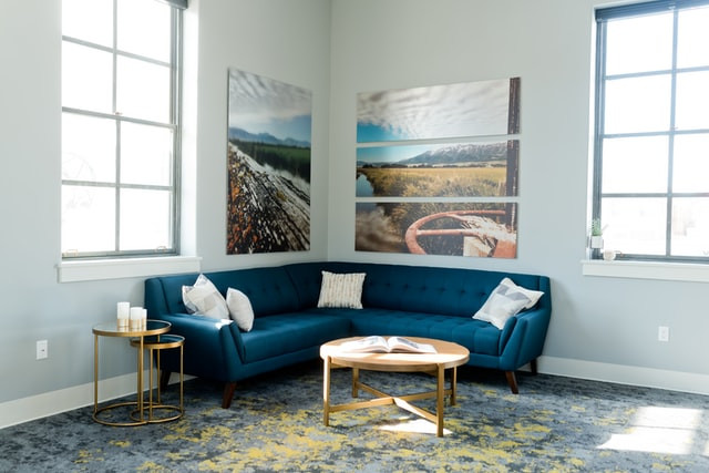 A living room with a blue sofa