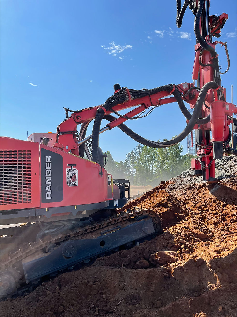 Close-up view of rock grinding machine smoothing a rocky surface