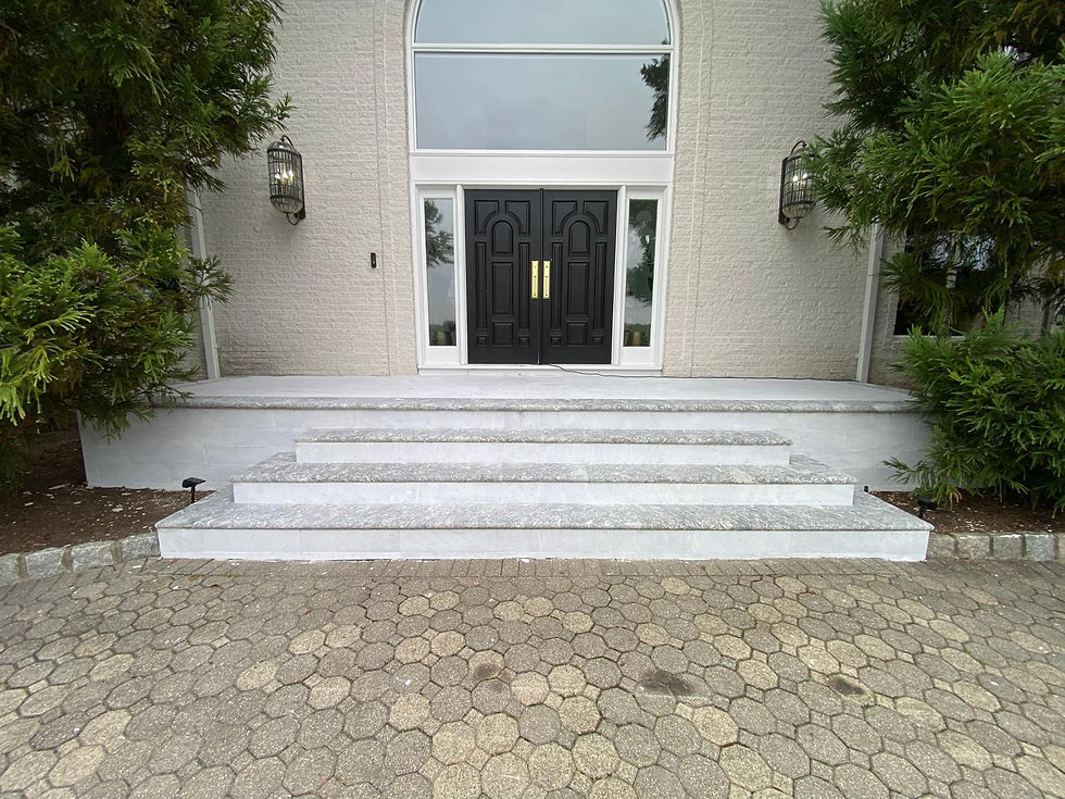 Newly installed large entry door with a wide window above, adding style and natural light to a modern home.