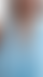 A semi-formal pastel blue backless midi dress with knot detailing at the waist and a V neck