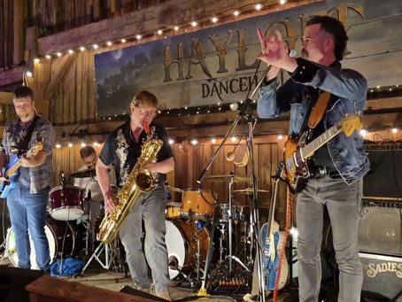 Meet Dusty Coyote, a garage-rock outfit operating out of the Kingston and Gananoque area, where surf guitar crashes into baritone sax, funk-punk grooves get their hands dirty, and the recording process doesn't require a digital babysitter. Their EP More Cowbell was tracked live, without a click track or autotune. Imagine that, four dudes in a room, reacting to each other in real time.