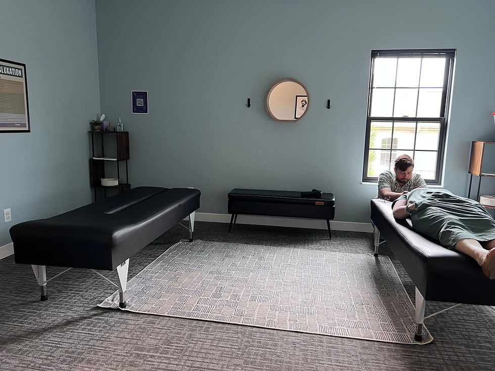 Eye-level view of chiropractic table in a calm treatment room