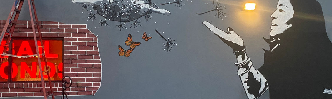 “Mural at All Out Bail Bonds in Downtown Fort Myers, Florida — painted by Artsemble Underground artists Brian Weaver and Cesar Aguilera, depicting a mother and daughter surrounded by nature and dance-inspired movement, symbolizing love, growth, and family connection.