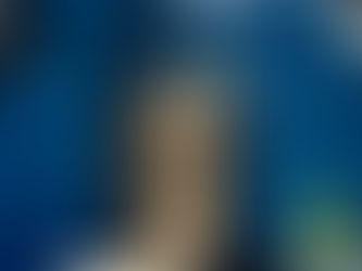 Close-up of a historic church tower against modern skyscrapers in downtown Houston, Texas.