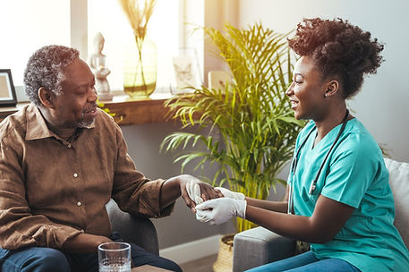 Black_male_patient_sitting_with_Black_clinician.original.jpg