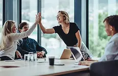 operational-excellence-woman-high-fiving-teammate.webp