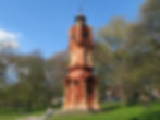 Full view of red-brick Victorian clock tower, Preston Park, Brighton.