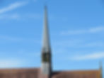 St. John the Evangelist church spire under a clear blue sky, Preston, Brighton
