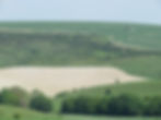 Rolling green hills and traces of ruins from Balsden Village, South Downs, Brighton.