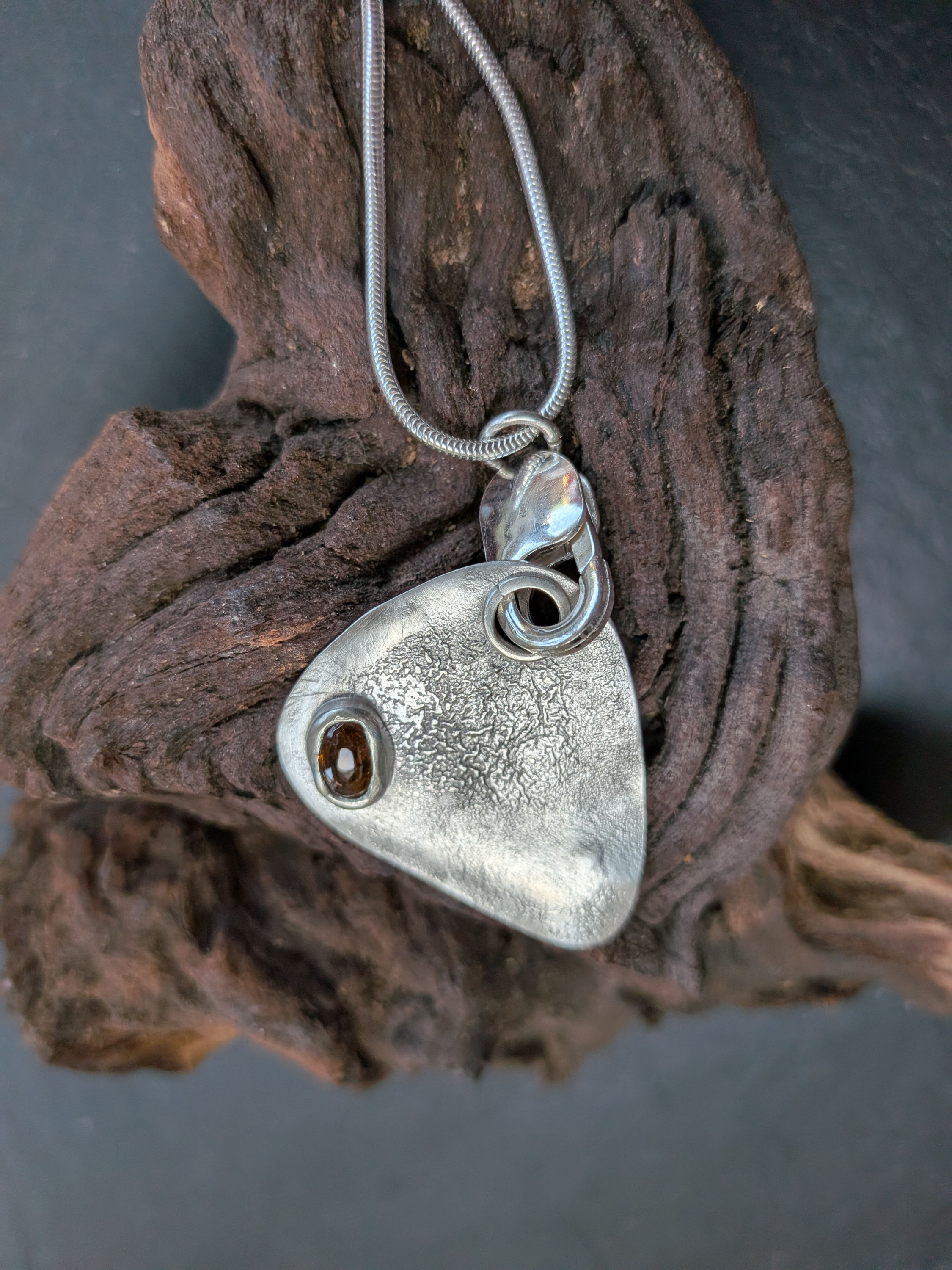 Silver Guitar Plectrum with amber coloured Tourmaline