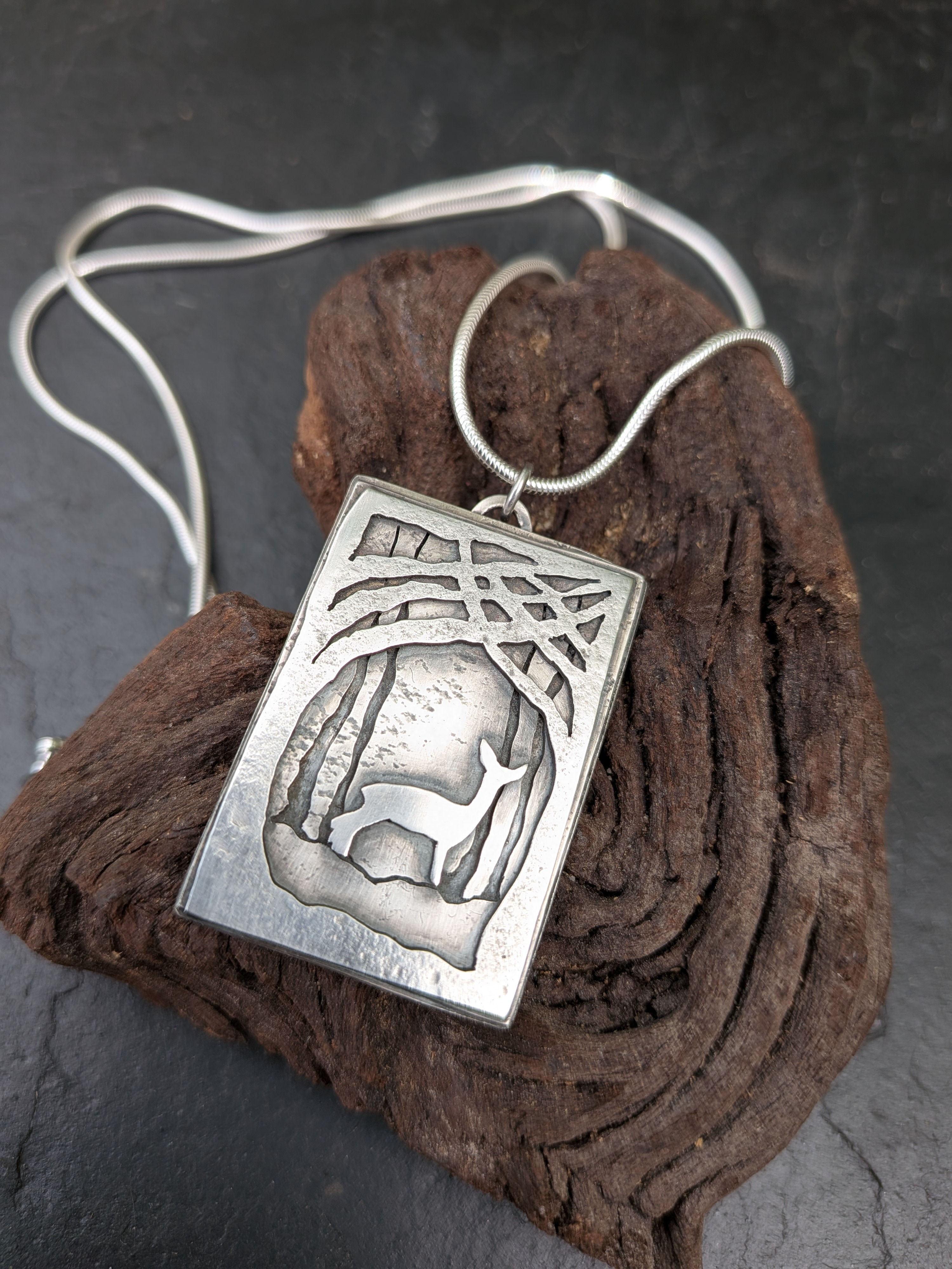 'Quiet strength' silver pendant