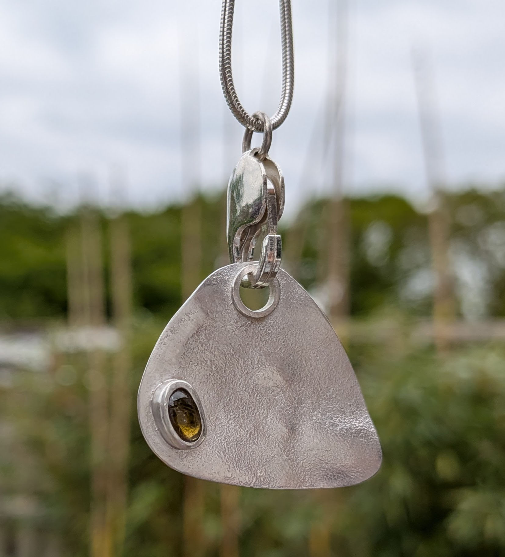 Silver Guitar Plectrum with green Tourmaline