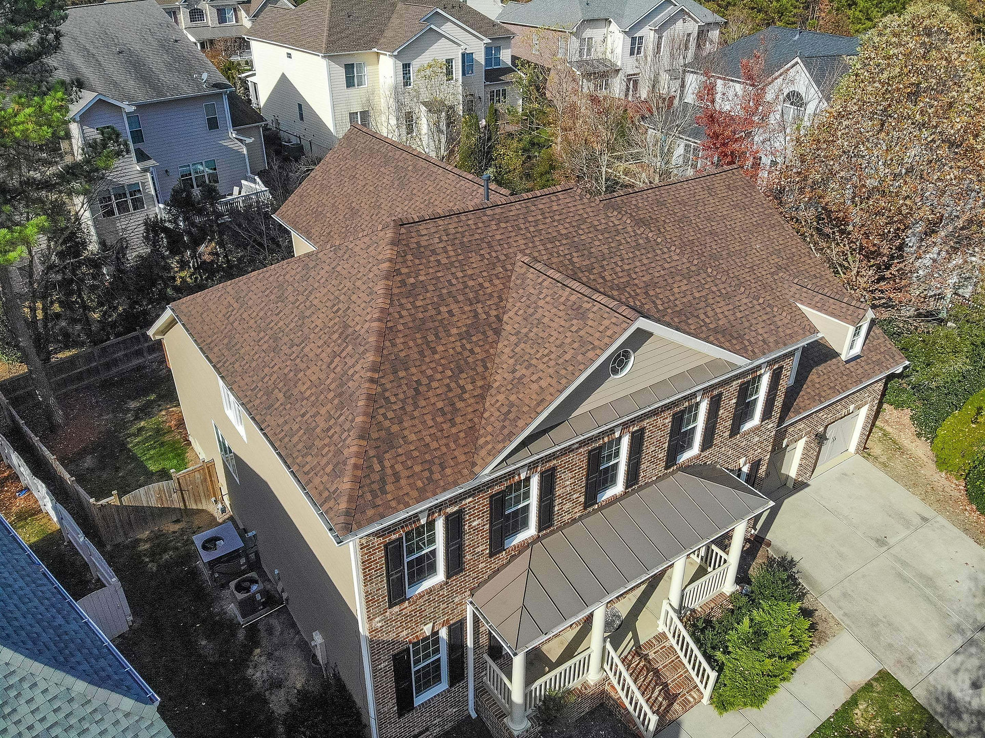 Burnt Sienna shingle roofing for homes, featuring popular roof colors and styles.