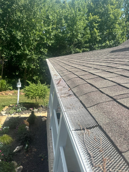 clogged gutters causing roof drainage issues