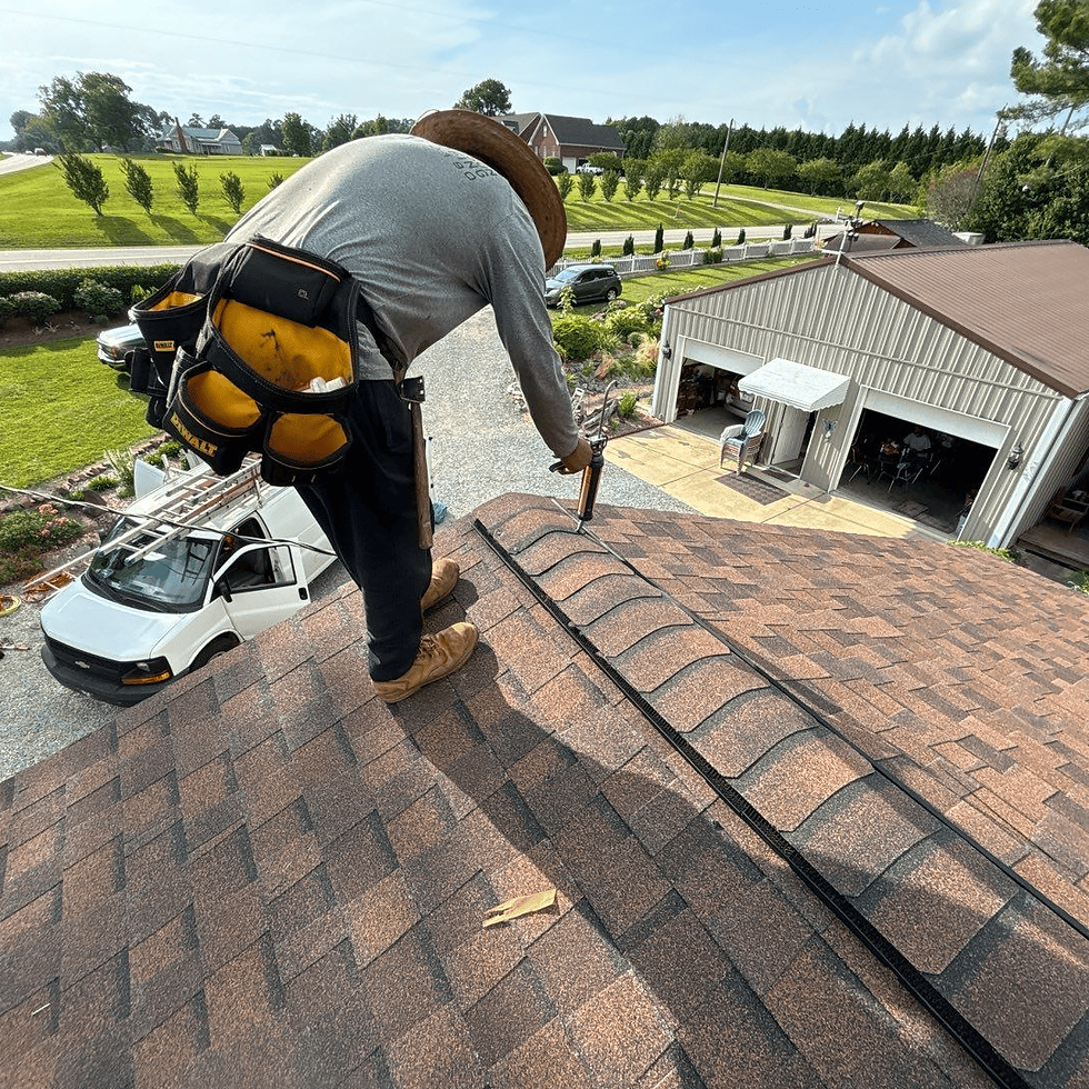 An Always Forward Roofing crew inspecting a storm-affected roof in NC.