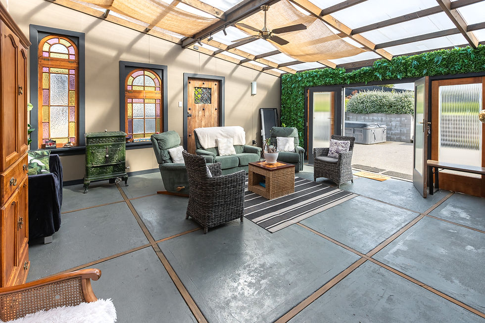 Indoor living area with seating and indoor-outdoor flow.