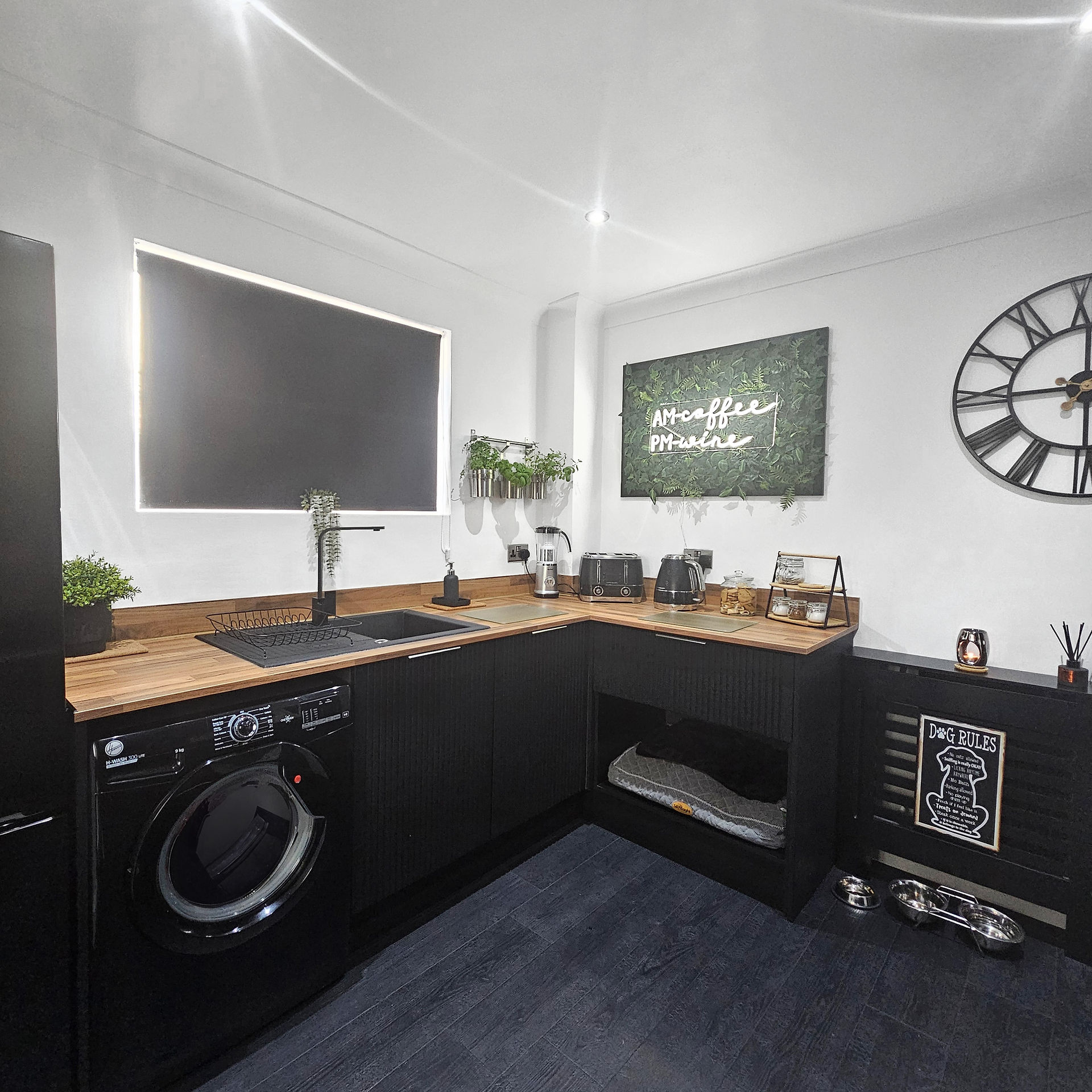 Black fluted Stockholm doors with minimal handles and slim profiled block Walnut worktops