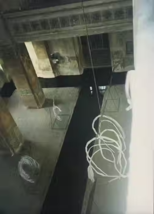 photograph of large installation by Barbara Benish with sculptures filling space with water passage