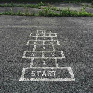 Chalk hopscotch on pavement