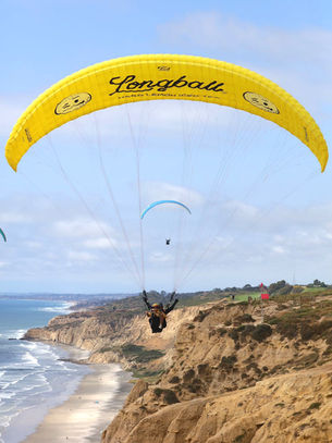 Paraglider flying over the cliffs